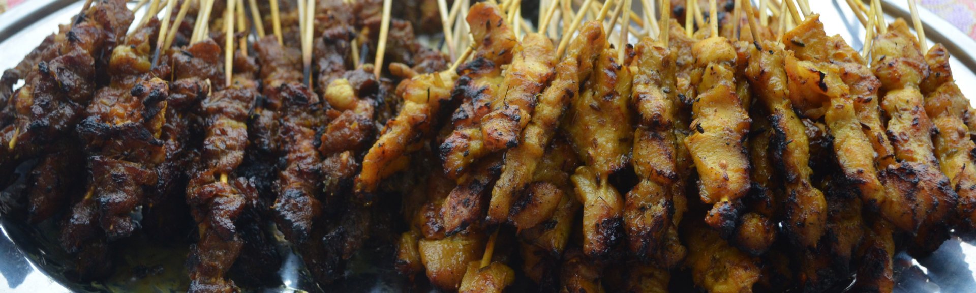Satay is typical of the island's Malay influence.