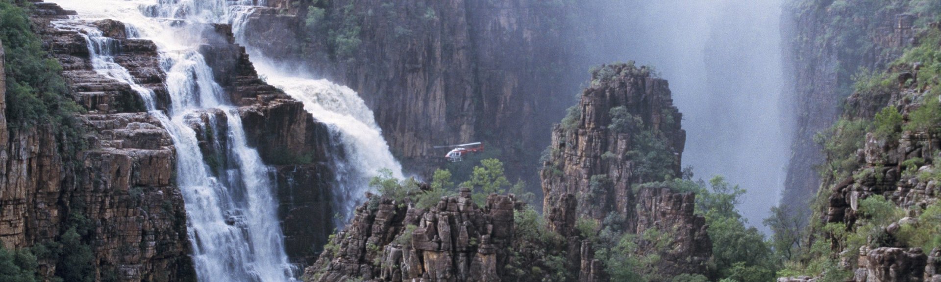 Helicopter over Twin Falls. Photo: Tourism NT