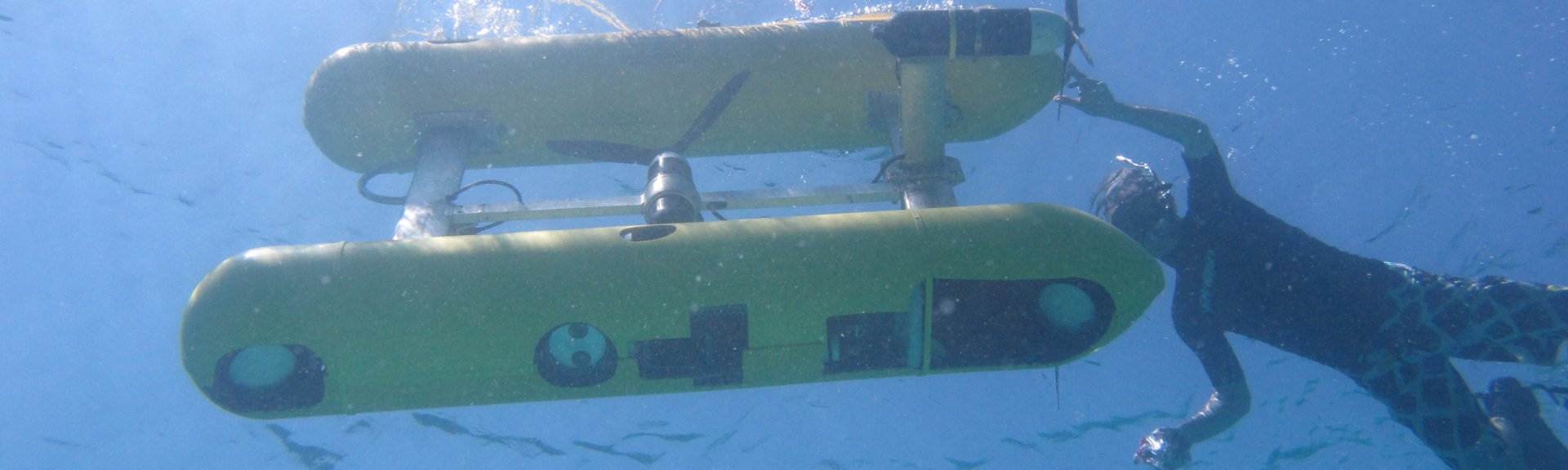 An autonomous underwater vehicle and diver. Photo by Kim Brooks