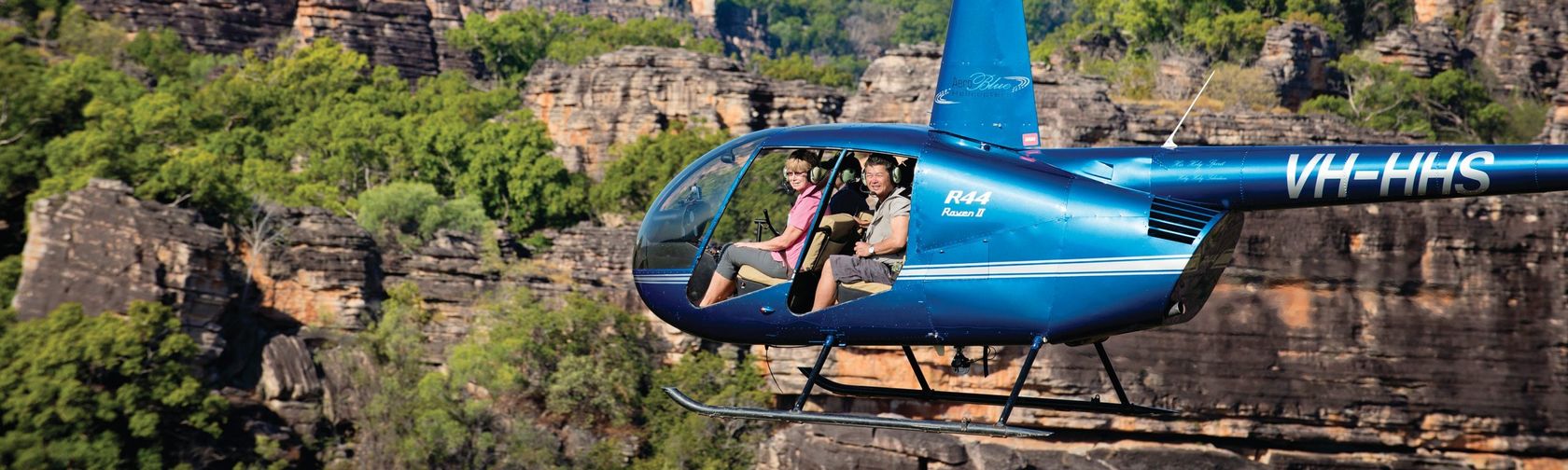 Passengers in a helicopter over Kakadu's escarpments. Photo: Tourism NT